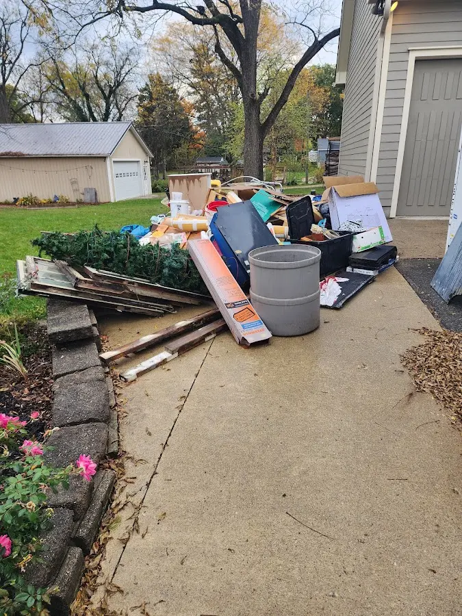 Dumpster being loaded with debris for Commercial Dumpster Rental in Hugoton
